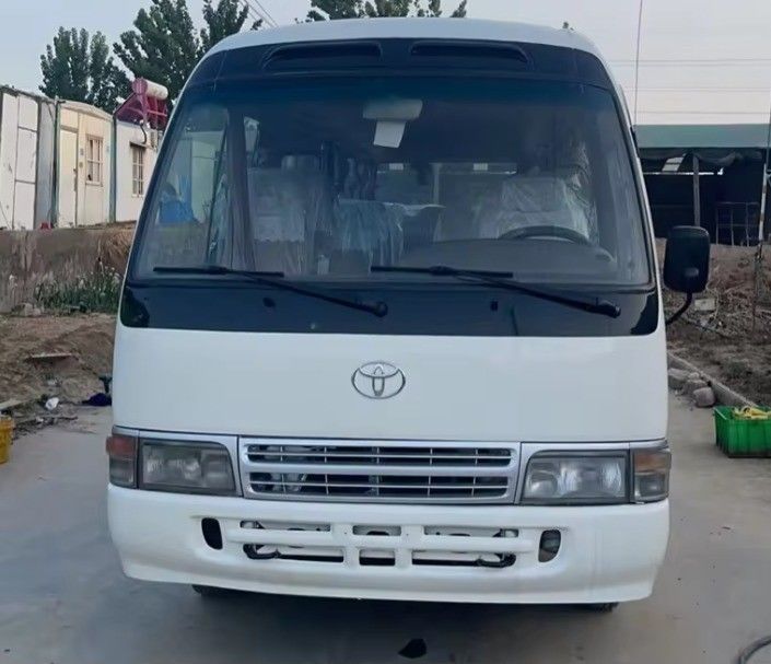 Ανοικτό αριστερό σύστημα οδήγησης Toyota Coaster Bus με 9.00R20 ελαστικά και 113/5200 Max Power